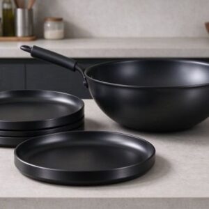 Hard-anodized circles are drawn into dark, durable cookware.